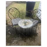 Iron patio chairs and small table