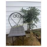 Chair and artificial plant