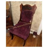Carved parlor chair has been upholstered with