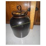 Brown glazed stoneware crock with braided handle