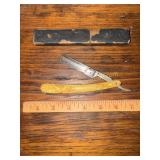 Vintage straight razor with celluloid handle