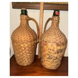 Pair of vintage wicker wrapped demijohn bottles