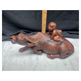 Chinese carved boy on water buffalo one horn is
