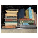 Crate of hard cover books