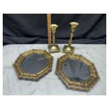 Pair of small decorative mirrors and brass candle