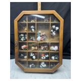 Whatnot wall cabinet with panda collection