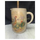 Pottery pitcher with chicken scene