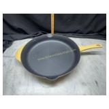 Yellow Calphalon enamel over cast skillet