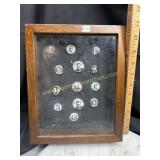 Vintage political pins in shadow box