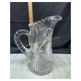 Heavy cut crystal pitcher has chip on spout