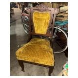 Carved parlor chair with velvet upholstery