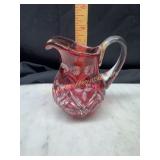 Heavy cranberry cut to clear small pitcher