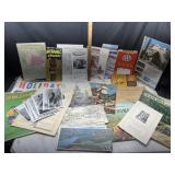 Collection of vintage travel brochures, maps,