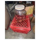 Milk crate and large kitchen jar