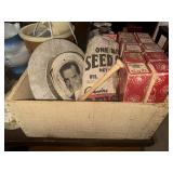 Crate with Nixon hat, player piano rolls, seed
