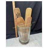 Wooden kitchen utensils in jar