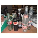 Sunrise, Pepsi and Coca-Cola bottles