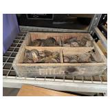 Old furniture casters in wooden drink crate