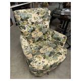 Vintage upholstered swivel rocker could use a