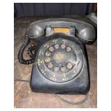 Black rotary desk telephone