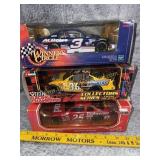 Three NASCAR 1:24 scale die cast cars