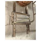 Primitive hand crank fruit press with fine