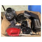 Box of kitchen appliances and knives