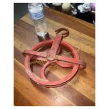 Red metal well pulley