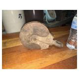 Antique iron and wooden pulley