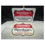 Metal and fiberglass Warehams security signs