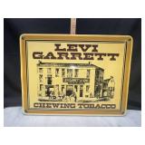 Levi Garrett sign plastic attached to board for