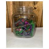 Kitchen jar of plastic cookie cutters