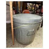 Galvanized metal garbage can with lid not full