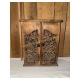 Cabinet with carved panels