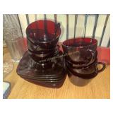 7 Ruby red cups and saucers