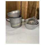 Vintage aluminum measuring cups and funnel