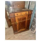 Early walnut washstand with unique basin that has