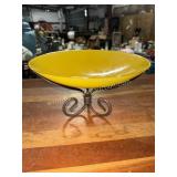 Yellow art glass bowl on metal stand