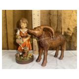 Carved wooden girl and ram figures