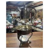 Vintage coffee carafe on warming stand