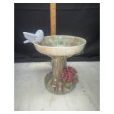 Small pottery bird bath with bluebird and flowers