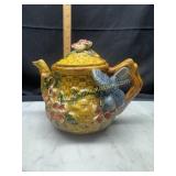Stoneware teapot with bird and flowers