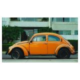 Orange Volkswagen Beetle Sedan