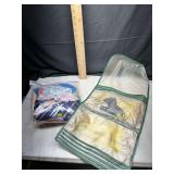 Hanging garment organizer with bagged textiles