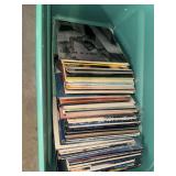 Green tote of vinyl record albums