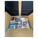 Assorted sports trading cards in box