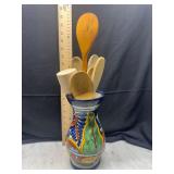 Wooden kitchen utensils in Mexican folk art vase