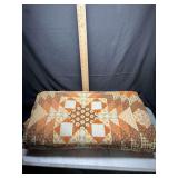 Orange and brown floral patchwork quilt