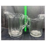 2 vintage heavy water pitchers