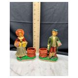 Pair of statue vases holding fruit and baskets